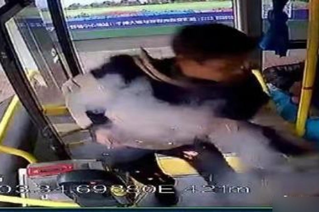 Security camera footage shows the man boarding the bus before lighting and throwing a package. Photo: Weibo