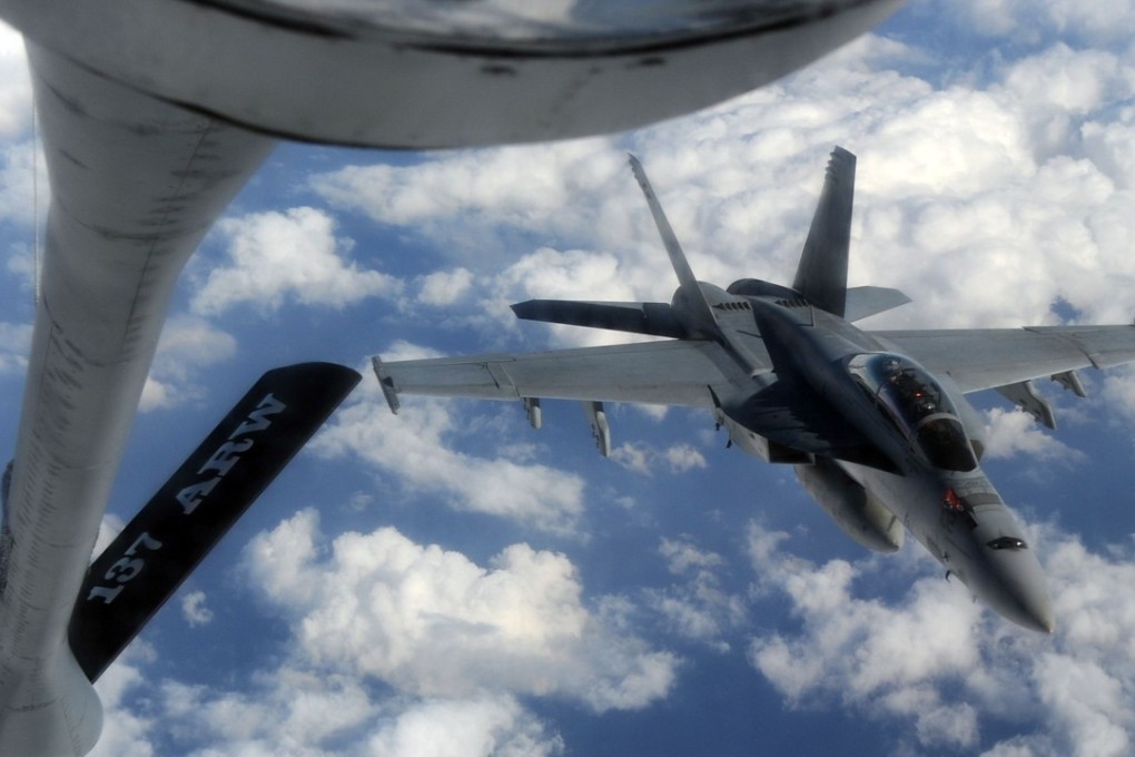 A US Navy FA-18 Super Hornet approaches a KC-135 air refuelling tanker above the South China Sea in this file photo. Photo: AFP