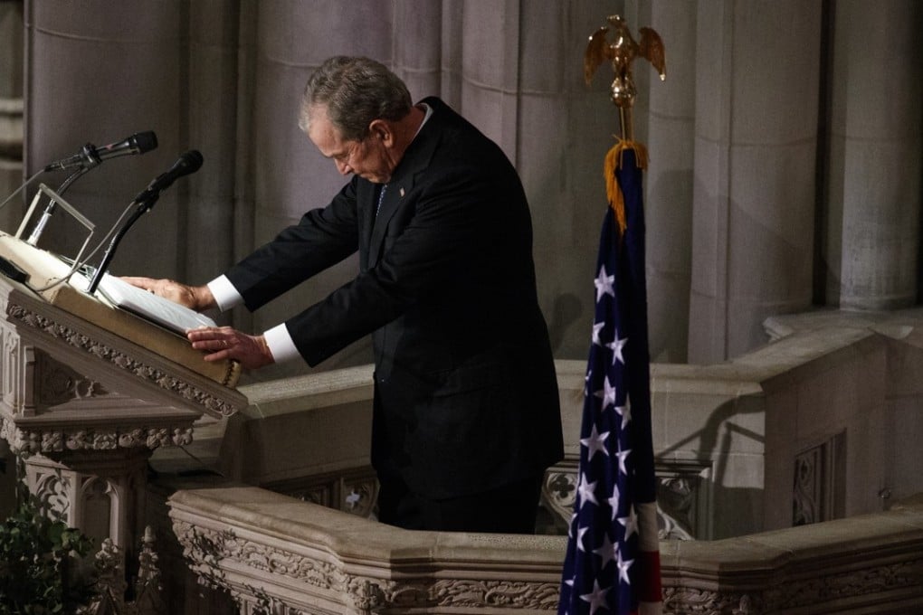 Former US president George W. Bush fights back tears as he speaks during the state funeral for his father, former president George H.W. Bush, at the National Cathedral in Washington on Wednesday. Photo: AP