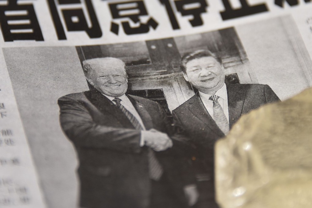 A Chinese newspaper covers the meeting between US President Donald Trump and Chinese President Xi Jinping. Photo: AFP