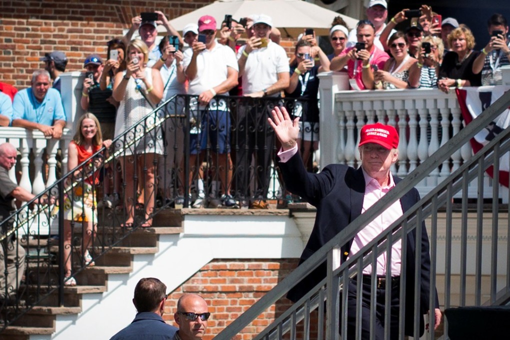 US President Donald Trump waves to the crowd during the final round of the US Women's Open golf tournament at Trump National Golf Club in Bedminster, New Jersey, on July 16, 2017. Photo: Kelvin Kuo-USA TODAY