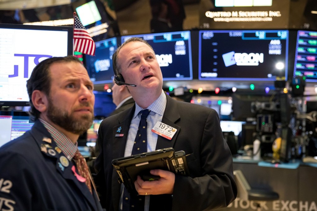 Traders work on the floor of the New York Stock Exchange on Friday. Photo: Bloomberg