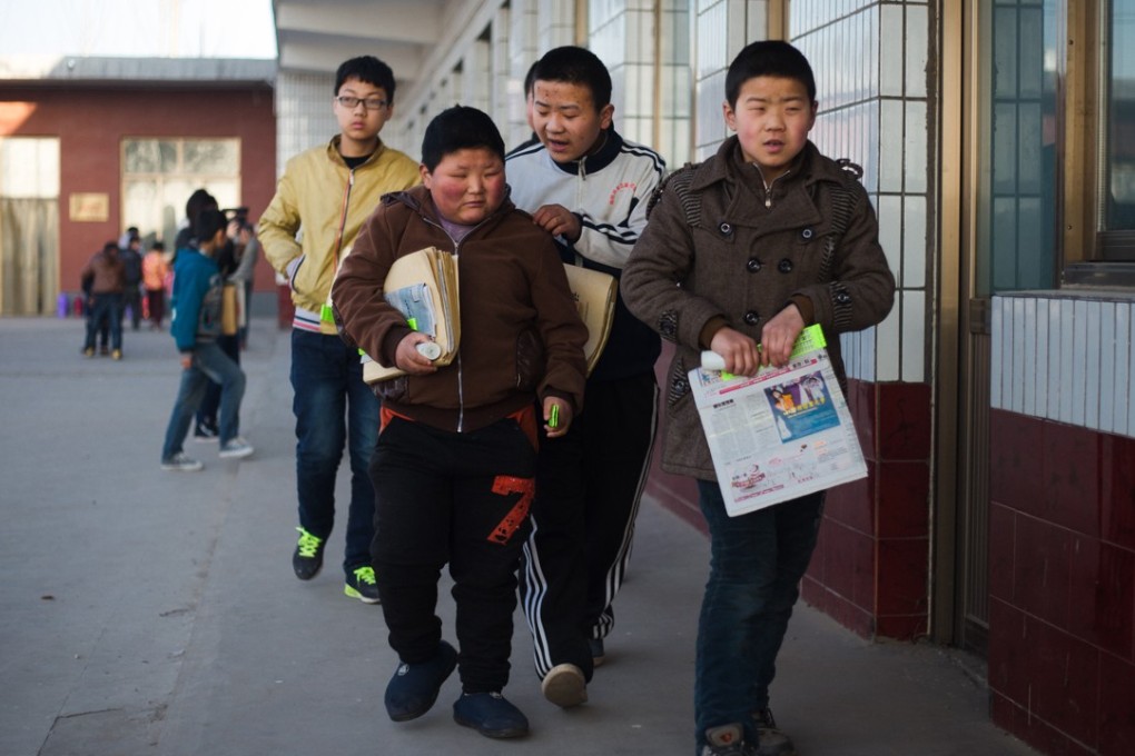 Students make their way to the first class of the day at the Mu Mengjie School for the Blind in Xingtai, Hebei province. Pictures: Nathan Gibson