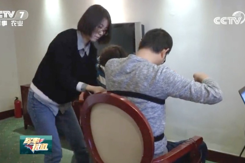 A video clip from CCTV shows Southern Theatre Command officials using equipment that military analysts suspect were “lie detectors” during the testing of candidates. Photo: Qq.com
