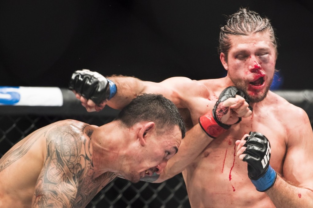 Max Holloway lands a left on Brian Ortega during their featherweight bout at UFC 231. Photo: AP