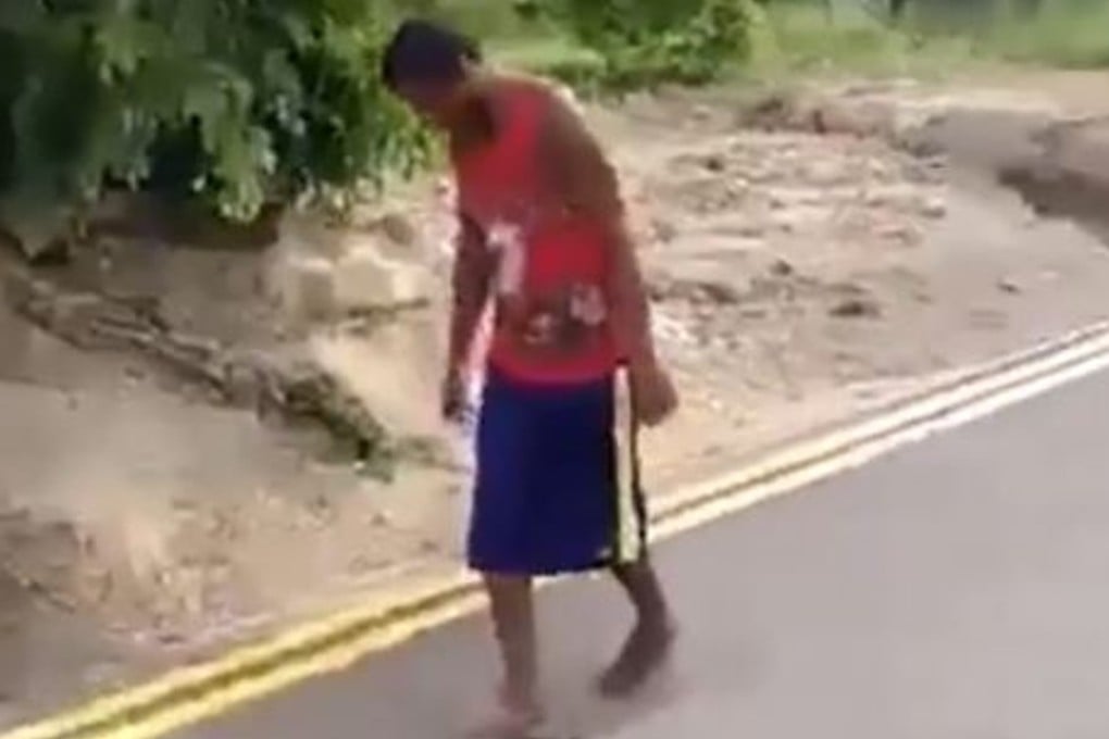 A drug user wandering along a road on Mauritius. Photo: YouTube