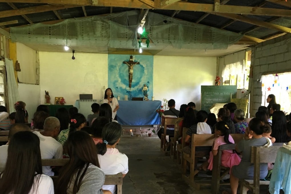 Jennifer Haygood, a researcher with the independent Ibon Foundation think tank, talks to villagers about the Kaliwa dam at a church near Manila. Photo: Handout