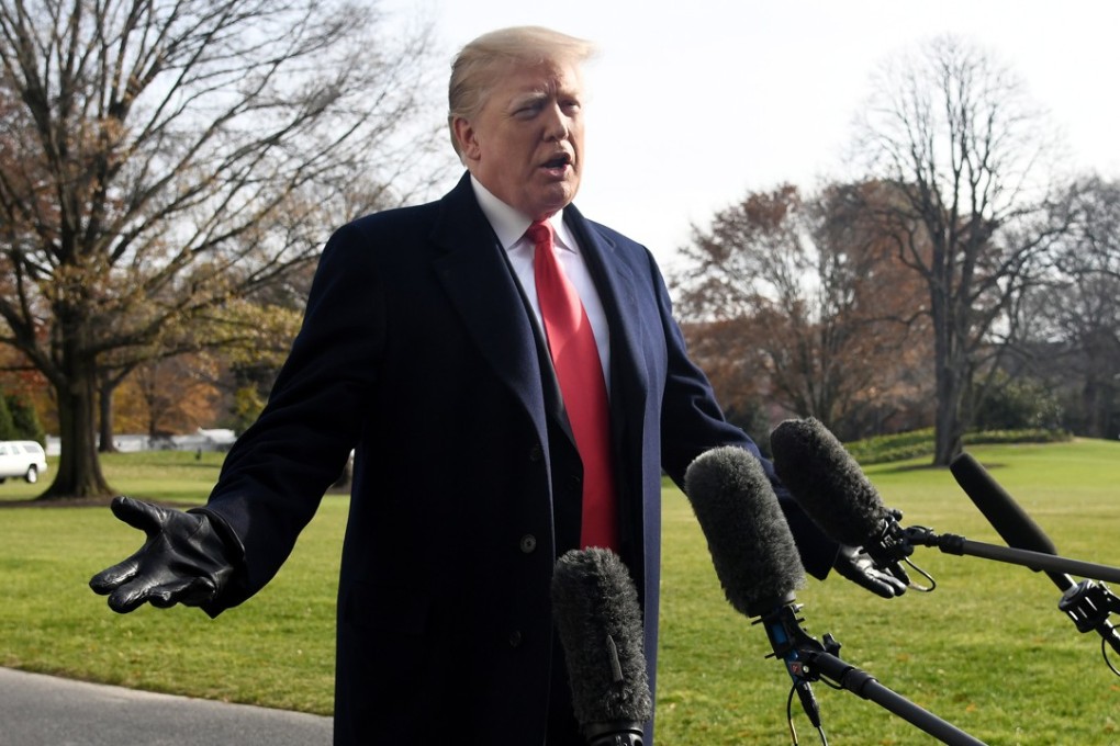 US President Donald Trump answers questions from the press before leaving the White House on December 8, 2018. Photo: EPA