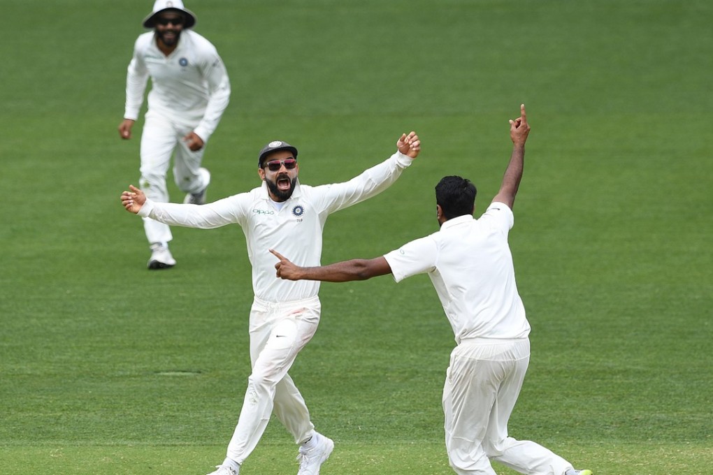 Indian captain Virat Kohli (centre) reacts after India defeated Australia on day five of the first test. Photo: EPA