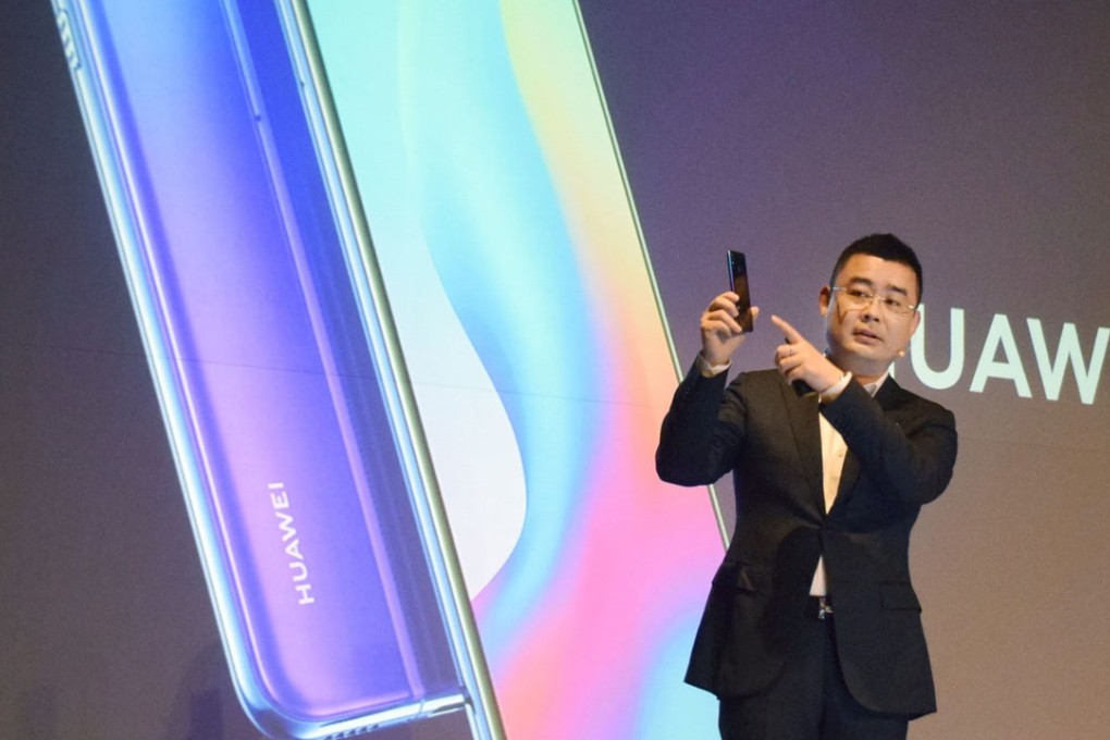 A Huawei Japan official talks in Tokyo on October 2, 2018, about the company's new smartphone, Huawei Nova 3, to be released in Japan on October 5. Photo: Kyodo