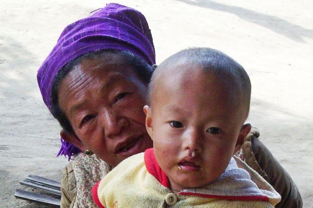 A Kachin refugee with her grandchild at a refugee camp in northern Myanmar. Photo: AP