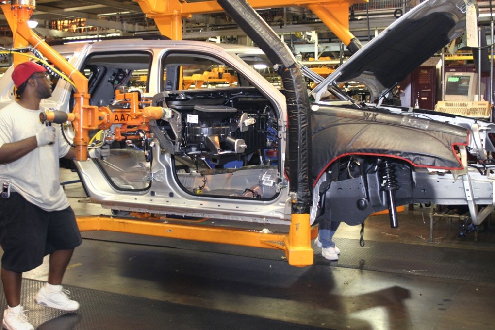 An assembly technician works at the DaimlerChrysler factory in Detroit, Michigan. Photo: Getty Images