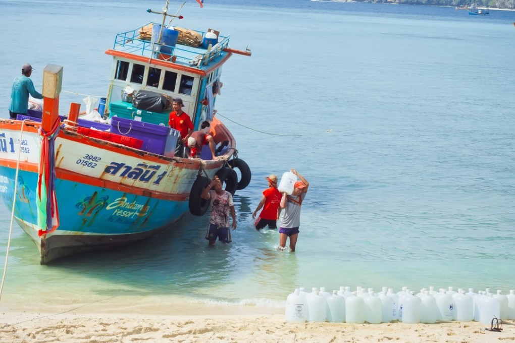 A boat delivers drinking water to Phi Phi Don Island, in Thailand, in 2016.