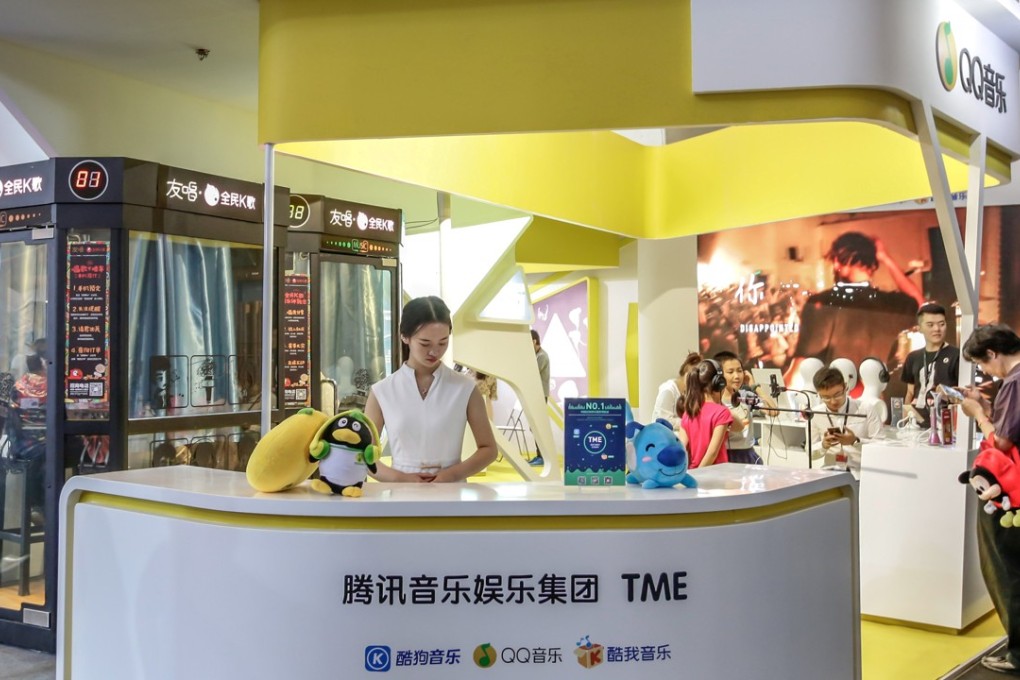 Visitors are seen at a booth of Tencent Music Entertainment at the Beijing Music and Life Show in Beijing, China, May 7, 2017. Photo: Reuters
