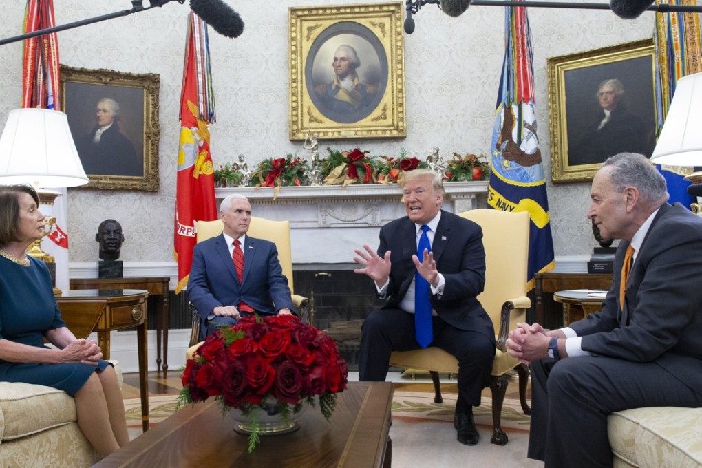 US President Donald Trump, joined by Vice-President Mike Pence, speaks while House Minority Leader Nancy Pelosi, a Democrat from California, and Senate Minority Leader Chuck Schumer, a Democrat from New York, listen during a meeting at the Oval Office of the White House in Washington DC. Photo: Bloomberg