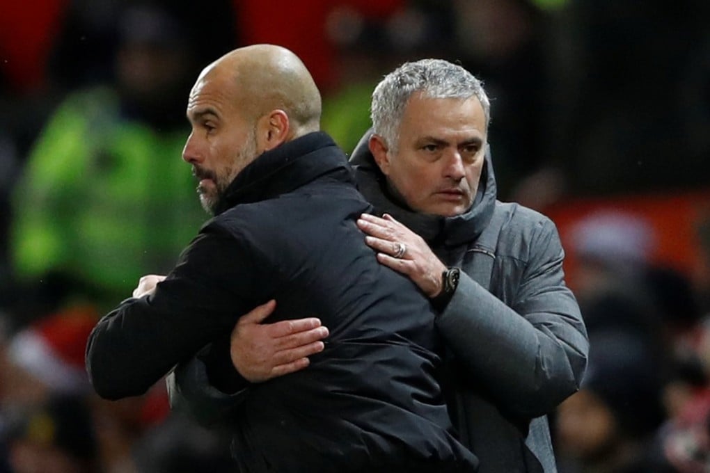 Pep Guardiola and Jose Mourinho embrace after the Manchester derby in December 2017. Photo: Reuters