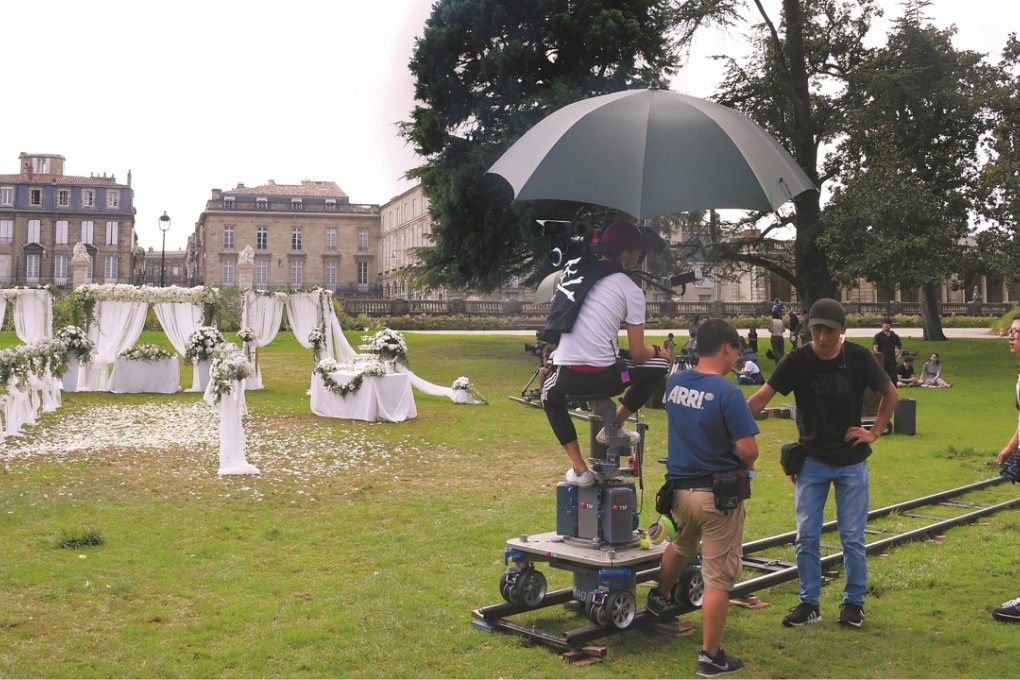A film crew works on the Chinese TV series Crocodile and the Plover Bird in a public park in Bordeaux, western France. Photo: AFP