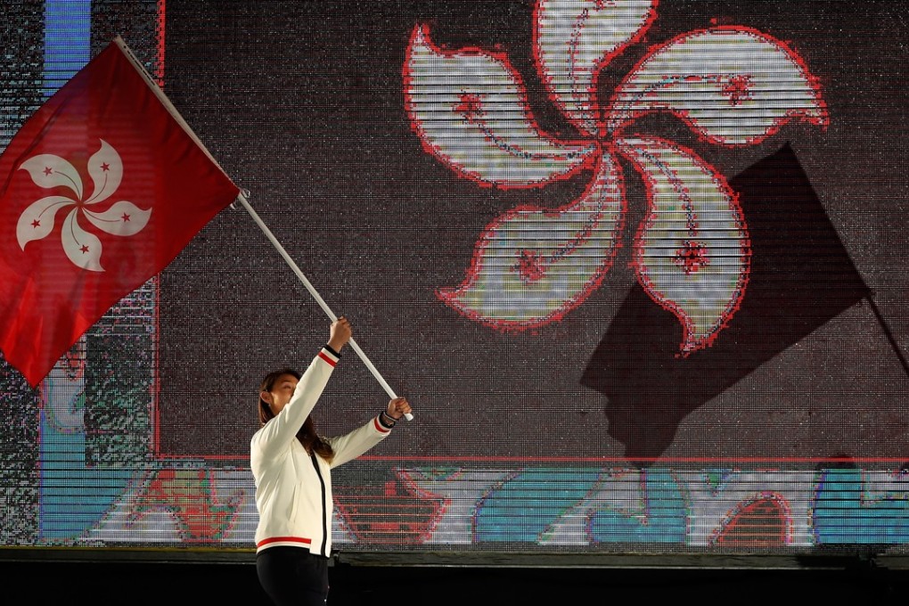 Épée fencer Kaylin Hsieh Sin-yan carries the flag for Hong Kong’s delegation at the opening ceremony of the Buenos Aires 2018 Youth Olympic Games. Photo: Xinhua