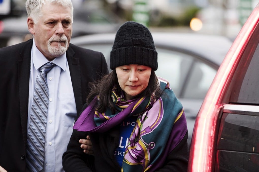 Huawei chief financial officer Sabrina Meng Wanzhou arrives at a parole office with a security guard in Vancouver after being released on bail. Photo: AP