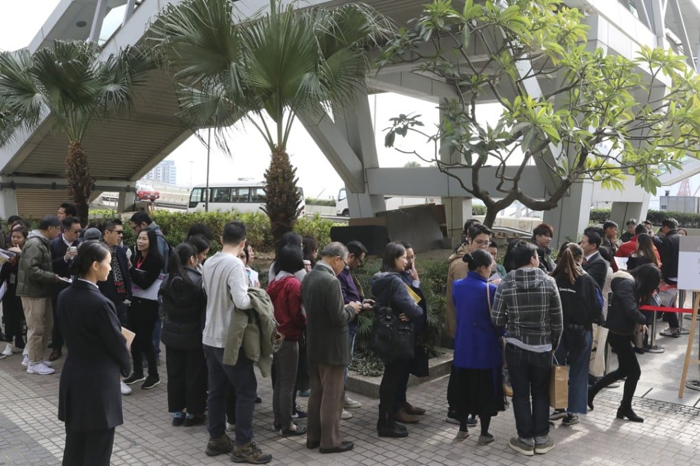 Potential buyers outside Sino Land’s sales office in Tsim Sha Tsui, waiting to get their hands on flats in the Grand Central project. Photo: K. Y. Cheng