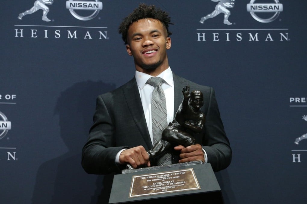 Oklahoma Sooners quarterback Kyler Murray poses for photos after winning the Heisman Trophy. He was then forced to issue an apology for tweets he made as a preteen. Photo: USA Today