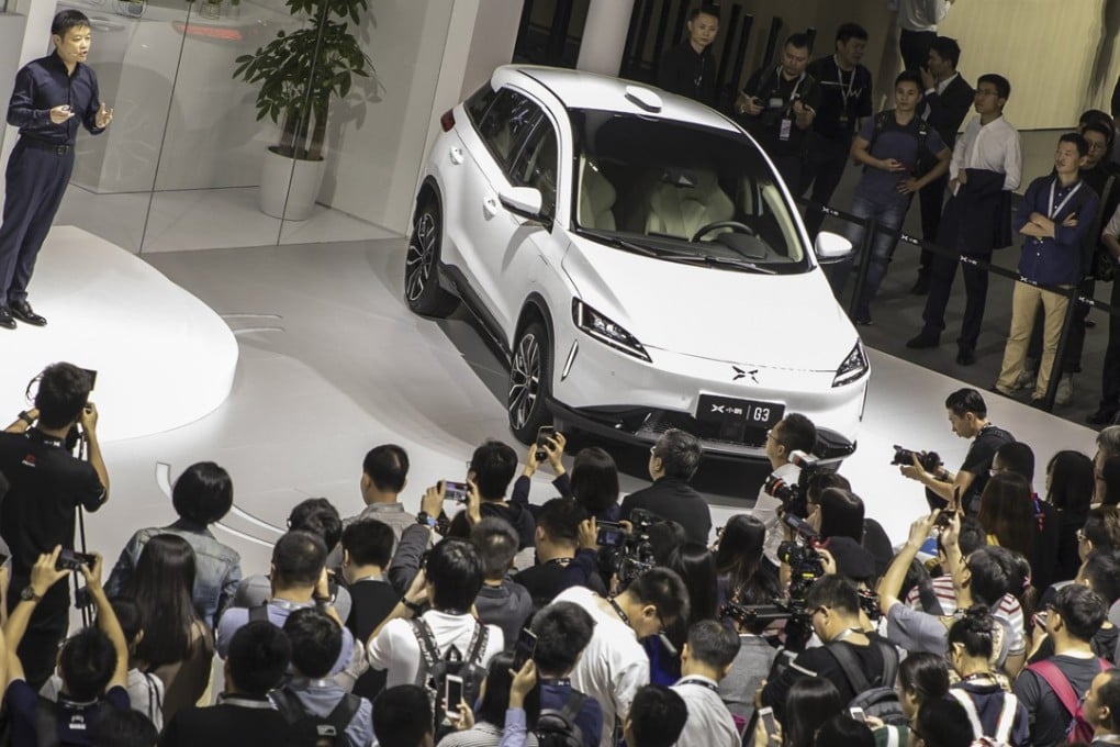 He Xiaopeng, chairman and co-founder of Xpeng Motors Technology Ltd., speaks as he stands next to the company's G3 electric sport utility vehicle (SUV) at the Guangzhou International Automobile Exhibition in Guangzhou, China, on Friday, Nov. 16, 2018. Photo: Bloomberg