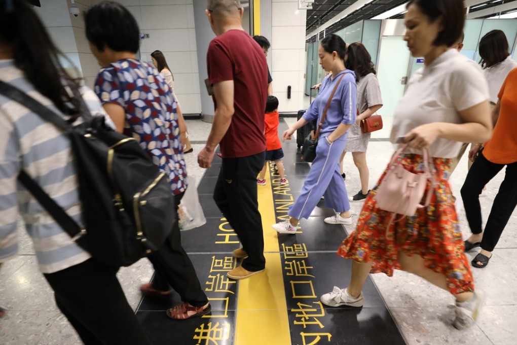 Passengers cross into the Hong Kong side of the West Kowloon terminus. Photo: Dickson Lee