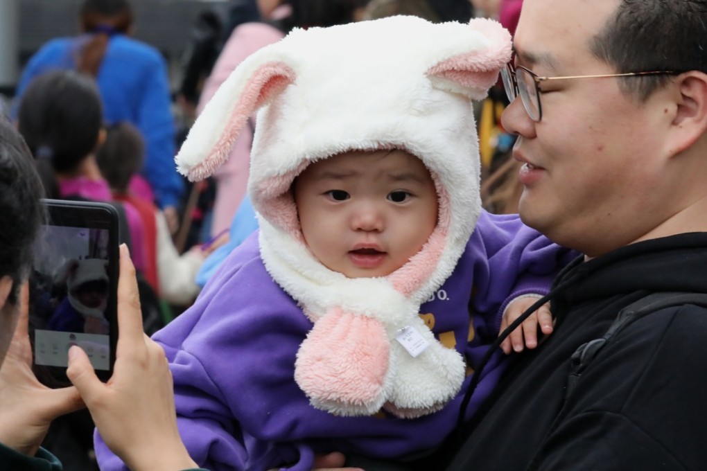 Bunny ears keep a child warm in Tsim Sha Tsui, as a cold snap hits Hong Kong on December 9. Photo: K.Y. Cheng