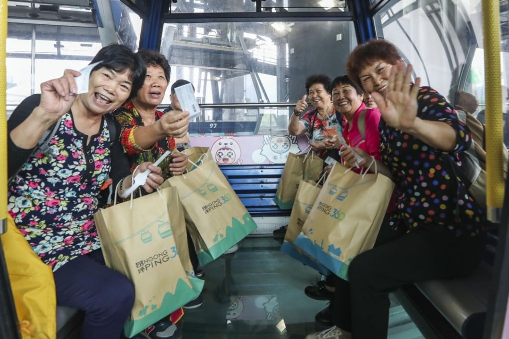 Visitors enjoy the Ngong Ping 360 cable car on Lantau Island. Photo: Xiaomei Chen