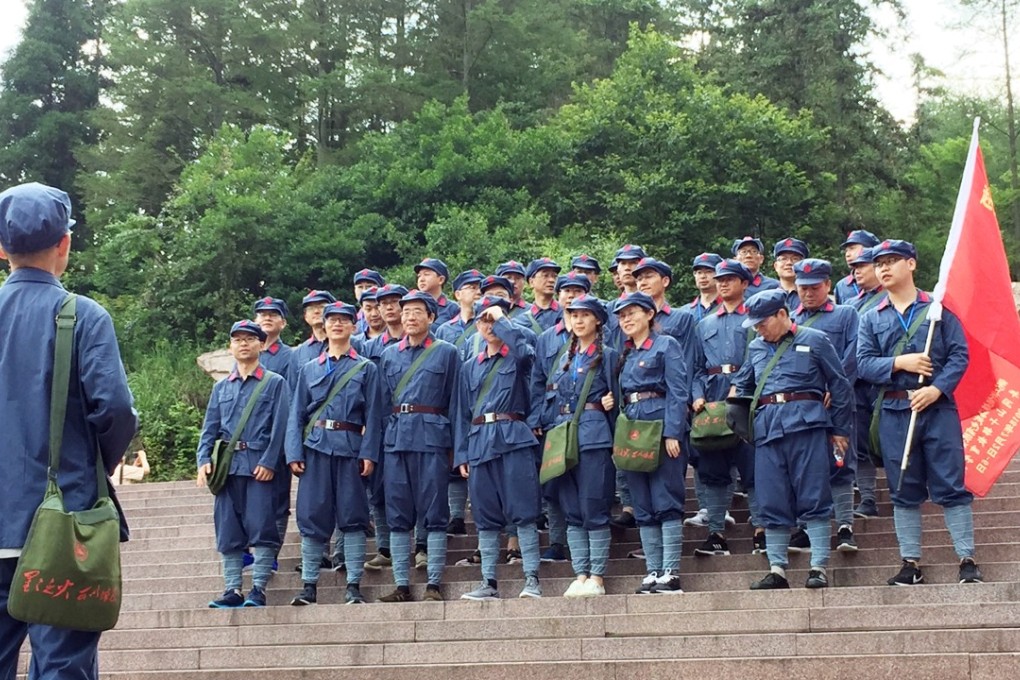 A group of visitors to the Jinggang mountains in Jiangxi province, considered the birthplace of the People’s Liberation Army on July 13, 2018. Many tours make it mandatory for visitors to dress up in Red Army uniforms. Photo: SCMP/ Josephine Ma