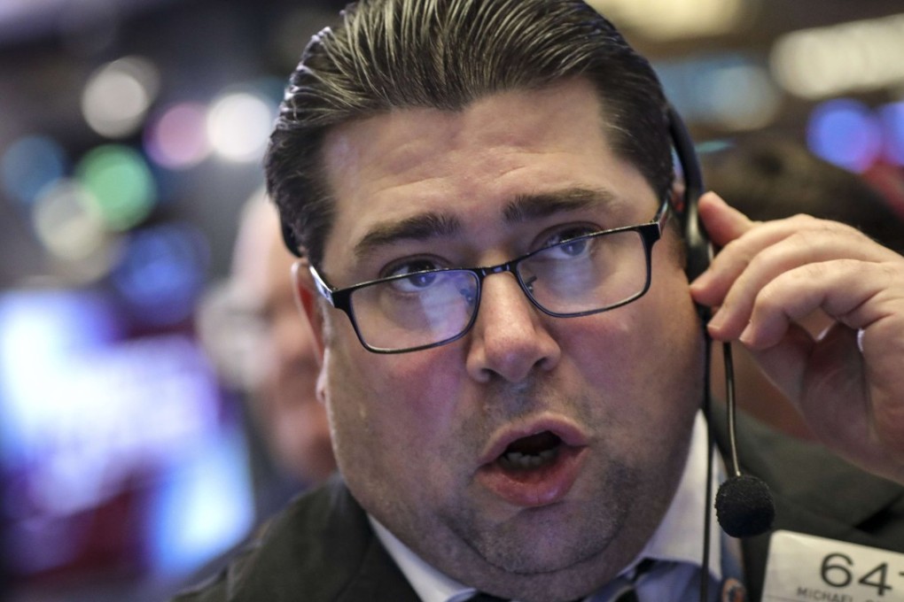A trader works on the floor of the New York Stock Exchange on Friday. Photo: AFP