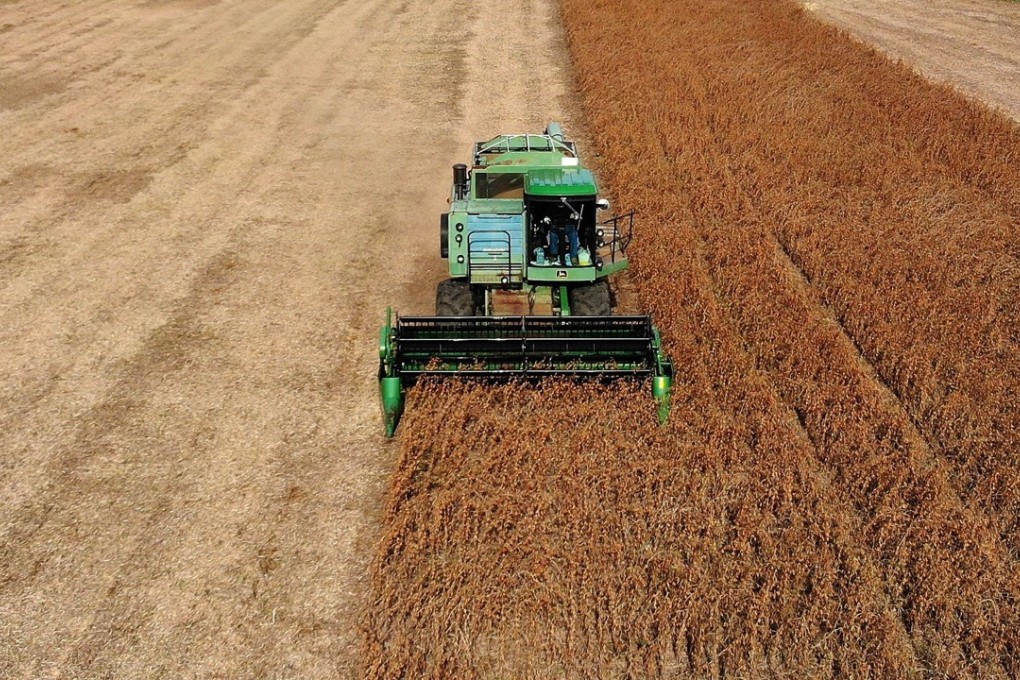 Mark Catterton driving a John Deere Harvester during the fall harvest on his soybean farm in Owings, Maryland on October 19, 2018. Most of Maryland's soybean crop is consumed in the state. Photo: Getty Images/AFP