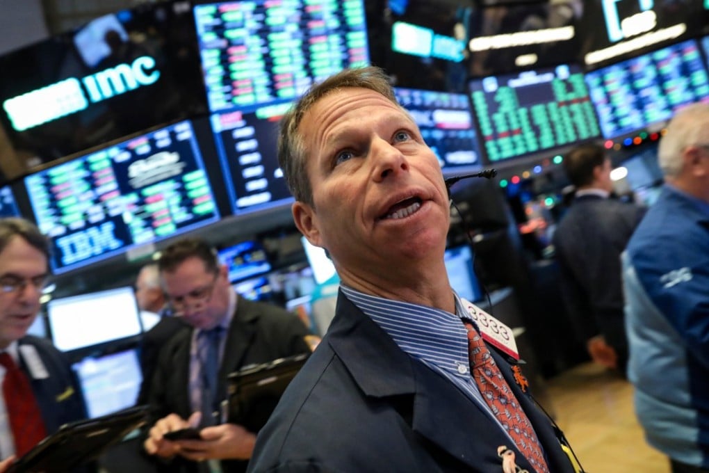 Traders work on the floor of the New York Stock Exchange on December 11. Photo: Reuters