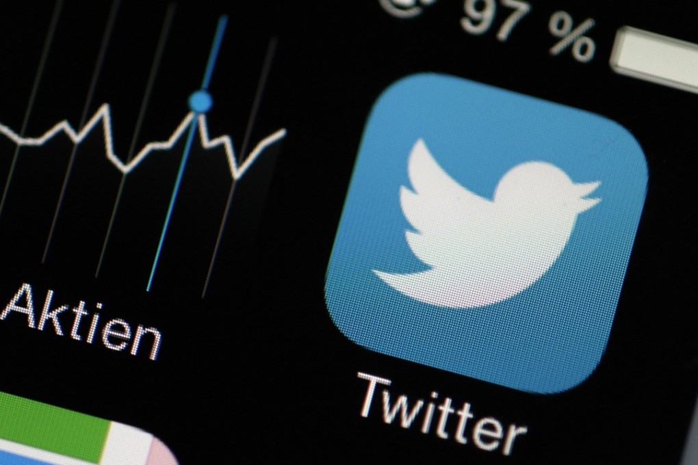 File photo of Twitter and a stock market app on a smartphone in Germany. Photo: EPA