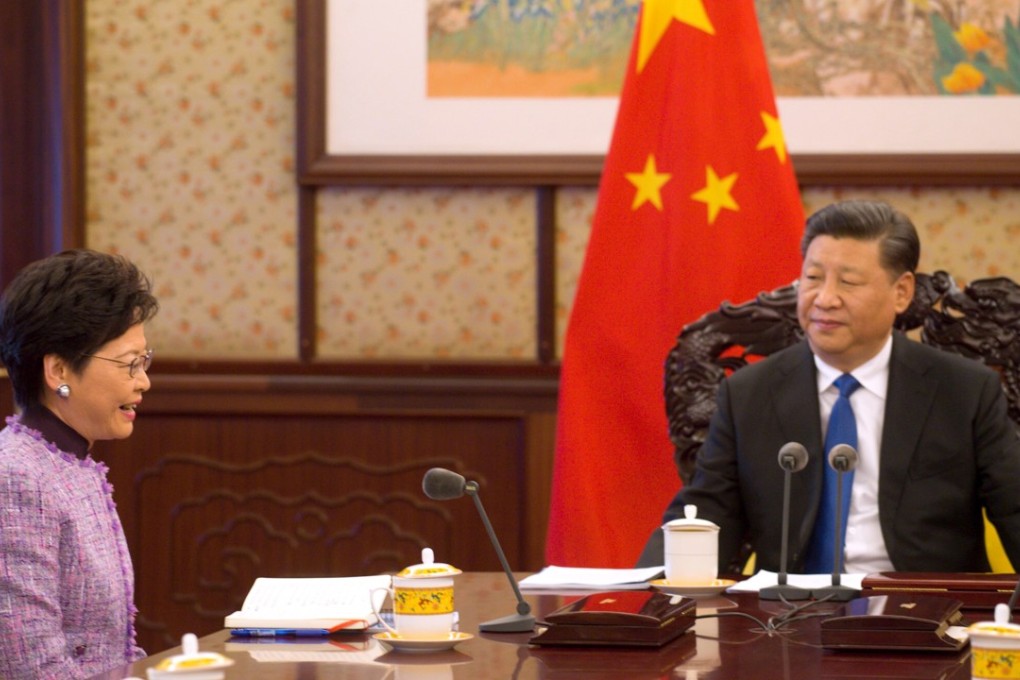 Xi (right) said Lam (left) had “planned for Hong Kong’s long-term development seriously”. Photo: Handout