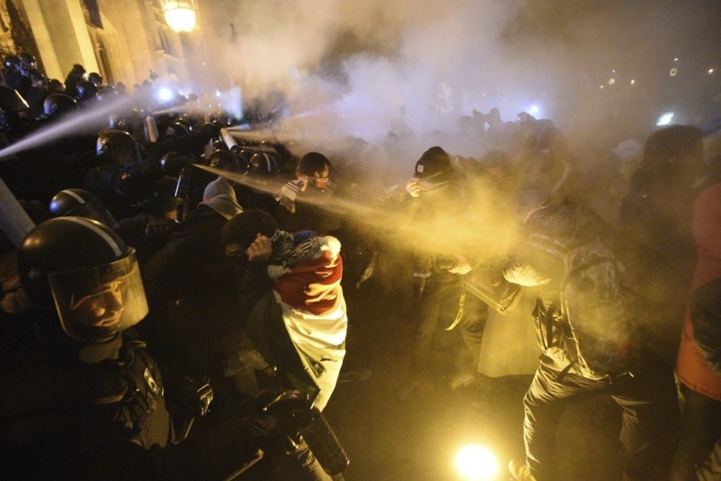 Protesters clash with police during a demonstration in Budapest on Thursday. Photo: AP