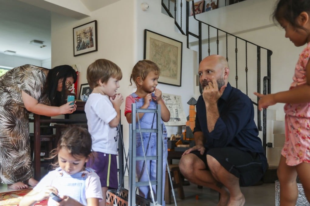Founder of Unit Bricks Timothy Stuart play unit bricks with children at home in Lantau, Hong Kong. Photo: Xiaomei Chen