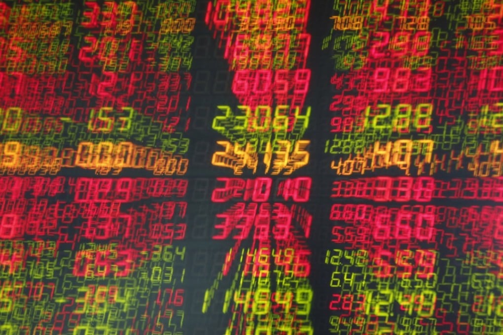 An electronic board showing the stock prices at a securities brokerage house in Beijing on November 21, 2018. Photo: EPA-EFE
