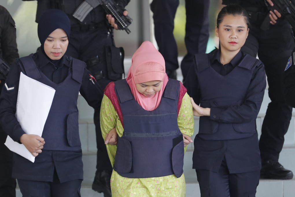 Siti Aisyah is escorted from court by Malaysian police. Photo: AP