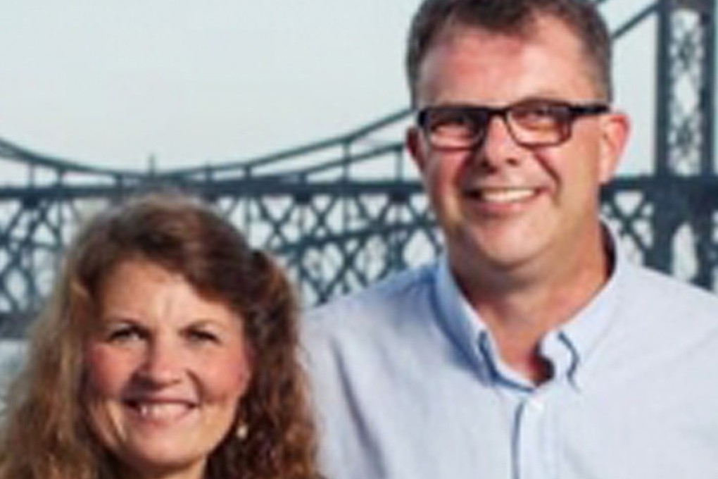 Kevin and Julia Garratt (centre) pose for a family photo in an undated picture. The couple were detained in China in 2014. Photo: AFP / Simeon Garratt