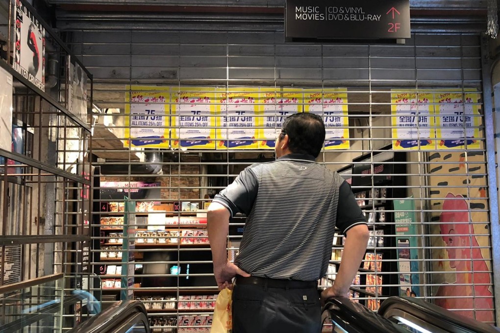 Shopper Mr Cheng arrives at HMV to find the store closed and no staff in sight. Photo: Danny Lee