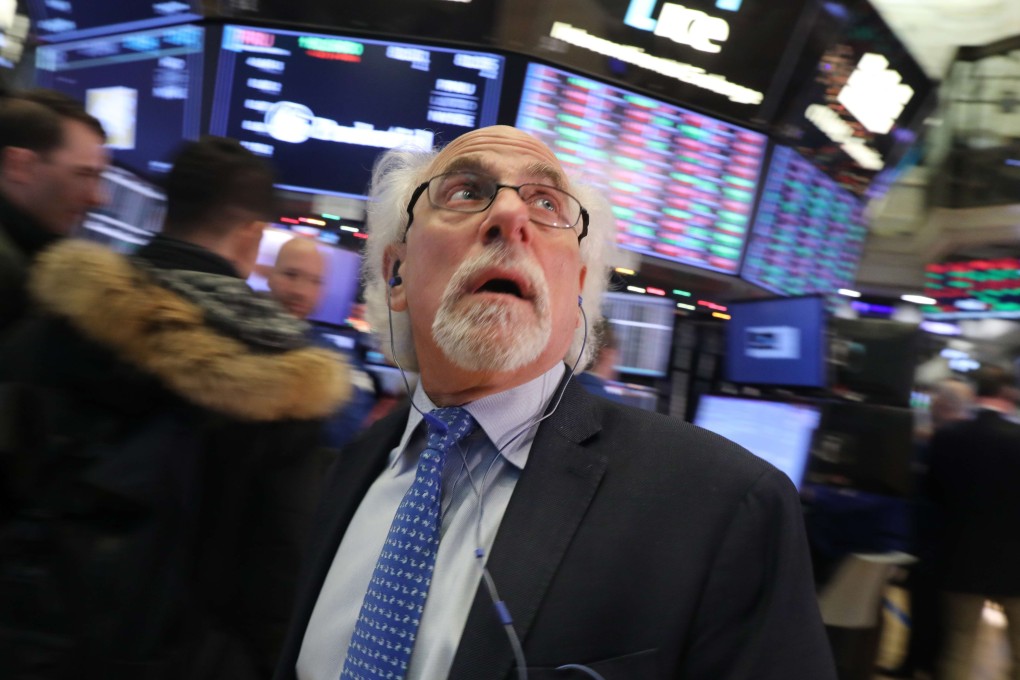 Traders work on the floor of the New York Stock Exchange on Monday. Photo: Agence France-Presse