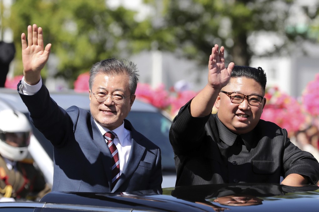 South Korean President Moon Jae-in and North Korean leader Kim Jong-un ride in a car during a parade through a street in Pyongyang on September 18. Photo: Pyongyang Press Corps Pool via AP