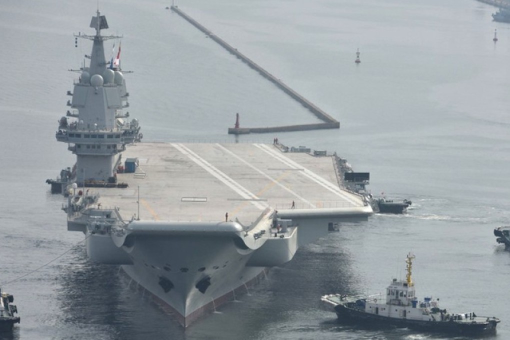 The first Chinese-built aircraft carrier, the Type 001A, leaves dock in Dalian, in northeastern Liaoning province. Photo: dfic
