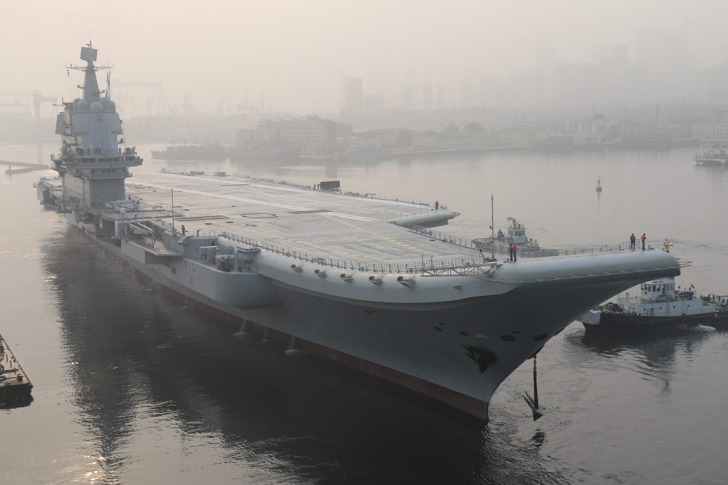 Workers at CSIC, which is building China’s first home-grown aircraft carrier (seen here in its home port) have been given lessons on how to keep state secrets. Photo: AFP