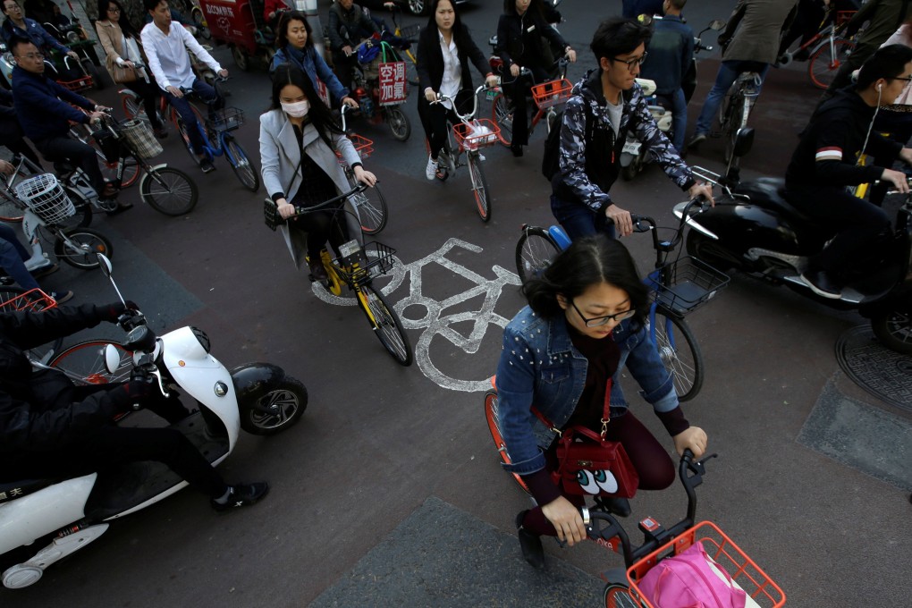 Bikes join the morning rush hour in Beijing’s central business district in April 2017. But Hong Kong is no Beijing or Shanghai. Photo: Reuters