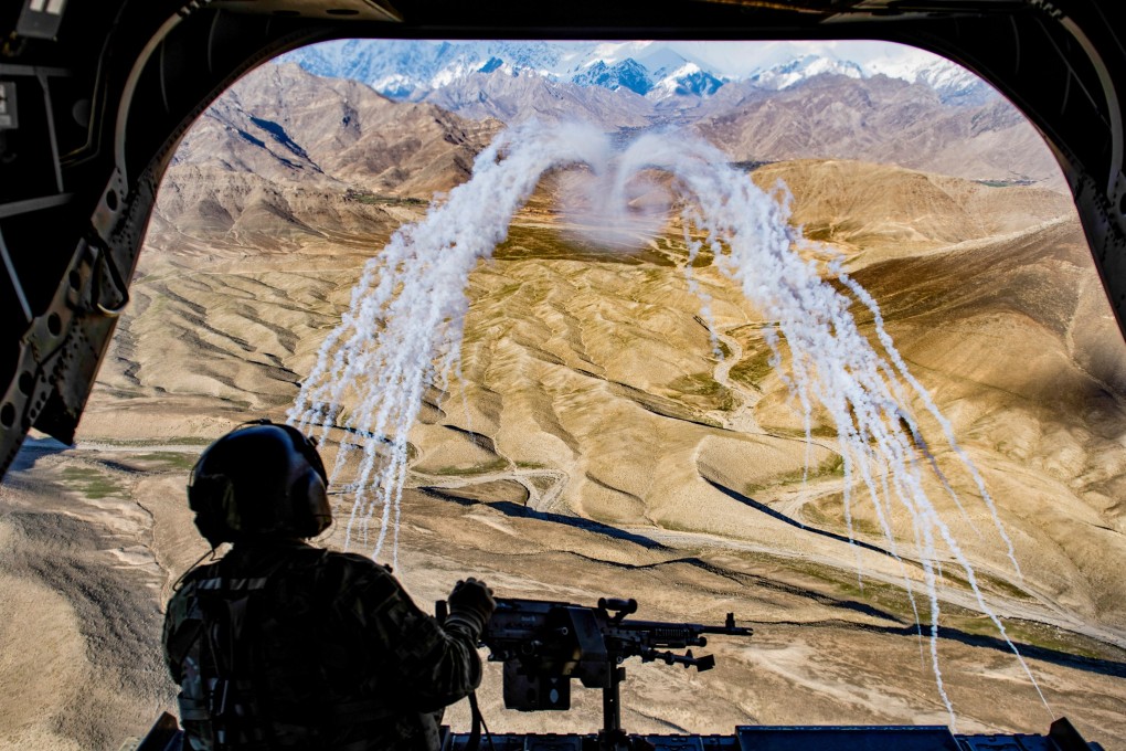 File photo of a US Army soldier on a Chinook helicopter during a training flight in Afghanistan. Photo: Reuters.