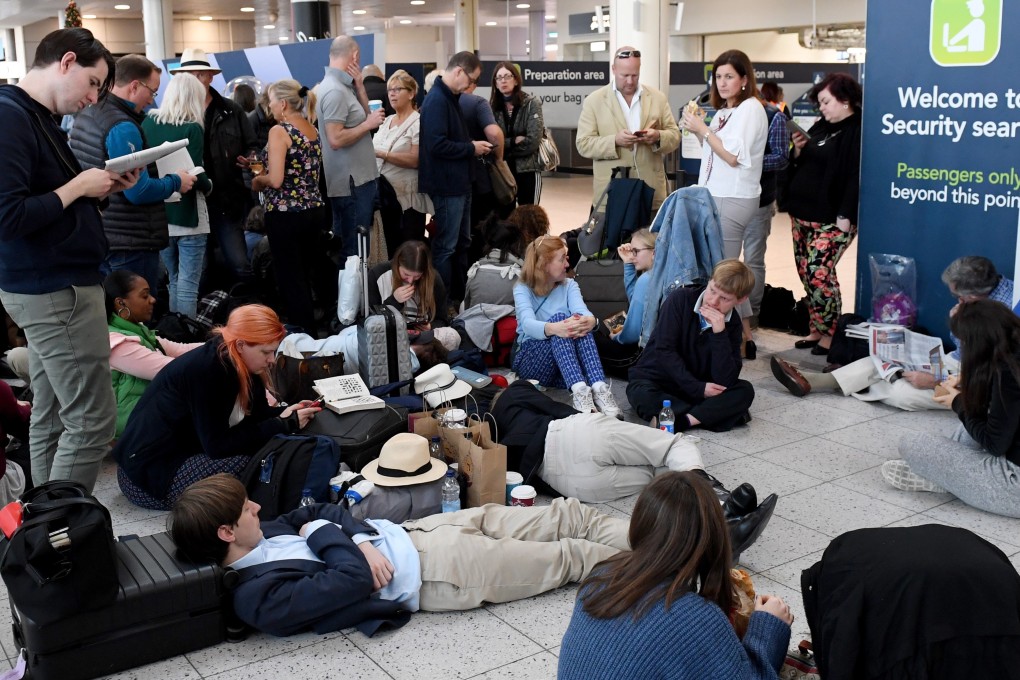 Stranded passengers wait in Gatwick Airport on Thursday after it was shut down by authorities due to drones flying nearby. Photo: EPA