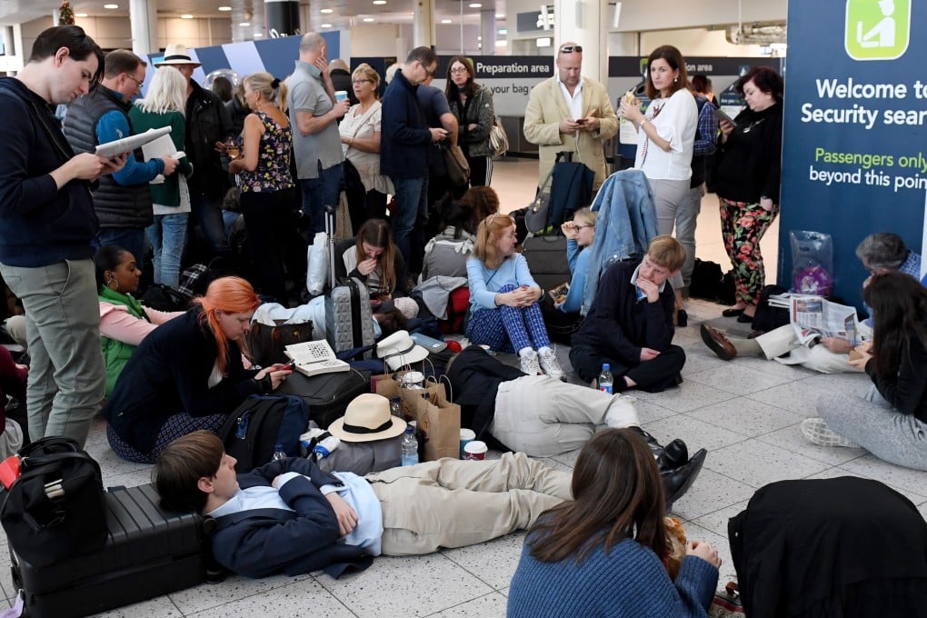 Stranded passengers wait in Gatwick Airport on Thursday after it was shut down by authorities due to drones flying nearby. Photo: EPA