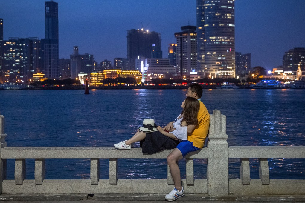 A couple rest on the waterfront of Gulangyu Island in Xiamen. Taiwan lies just about 300km across the strait. Photo: EPA